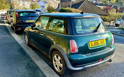 GJ06 JUE, a Green Mini Cooper parked in Hollingdean